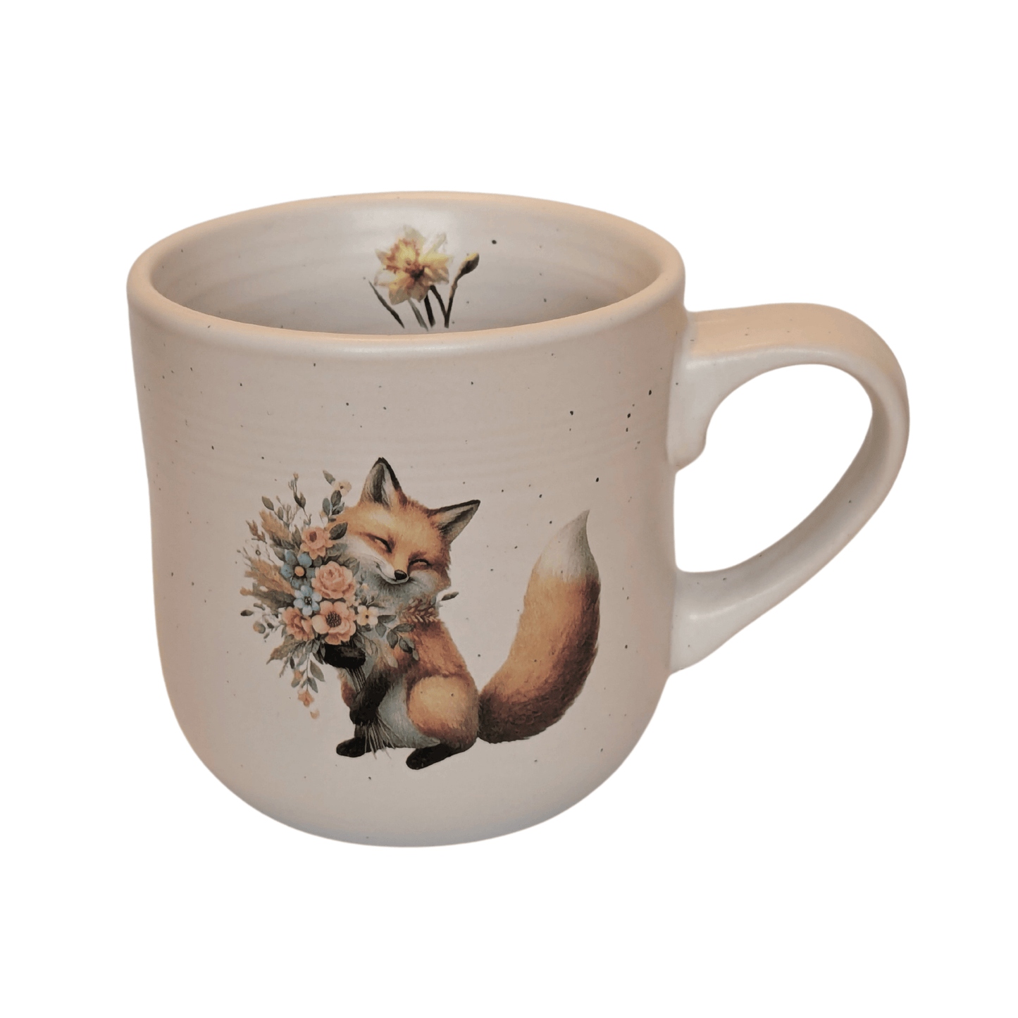 A stoneware mug with an image of a fox holding a bunch of flowers and a small daffodil motif on the inner mug.