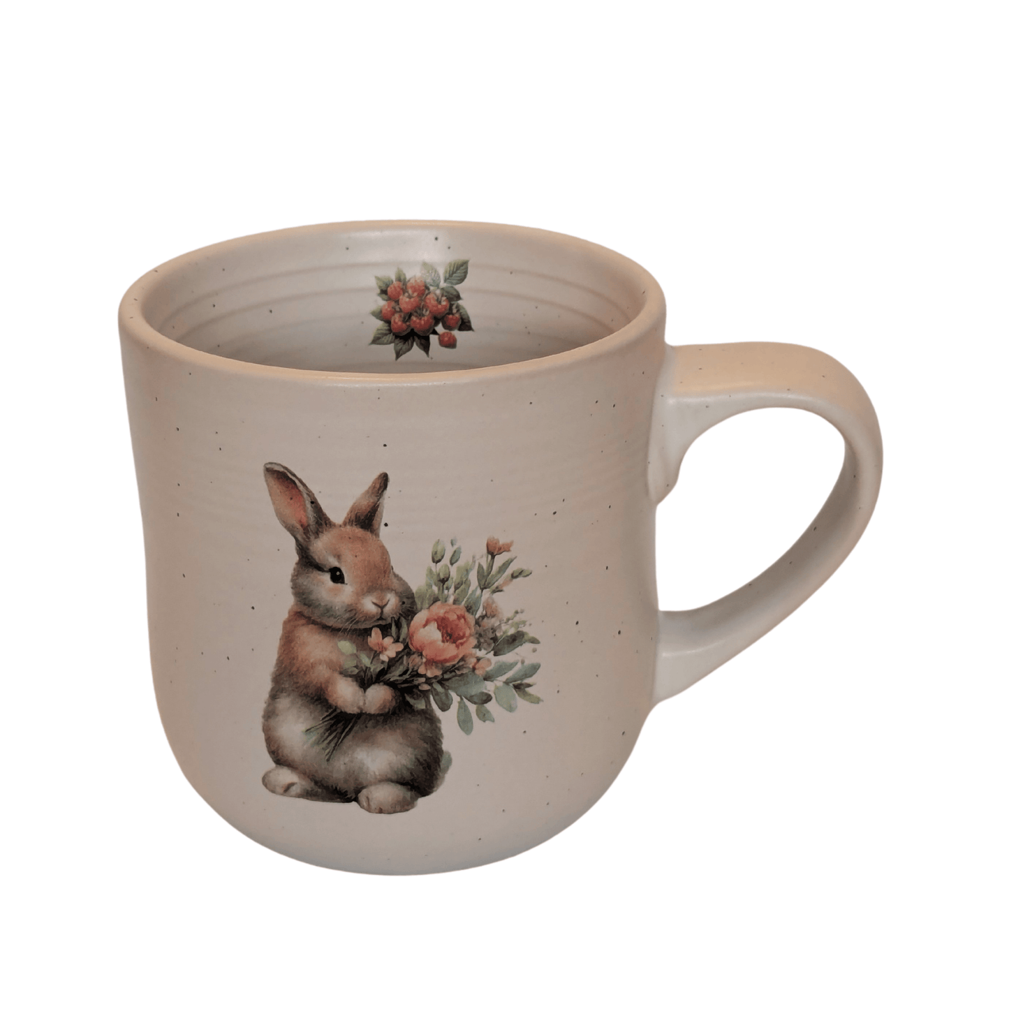 A stoneware mug with an image of a rabbit holding a bunch of flowers and a small raspberry motif on the inner mug.