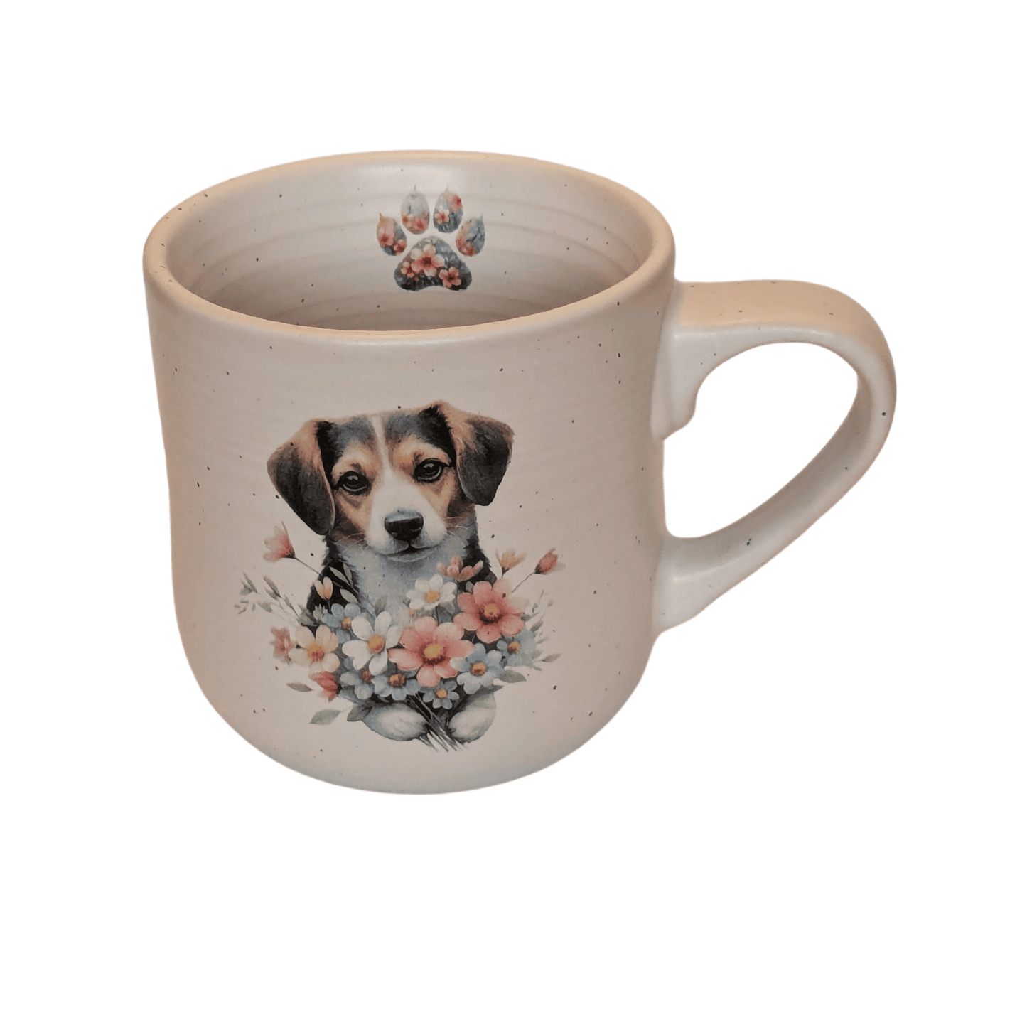 A stoneware mug with an image of a dog holding a bunch of flowers and a small paw print motif on the inner mug.