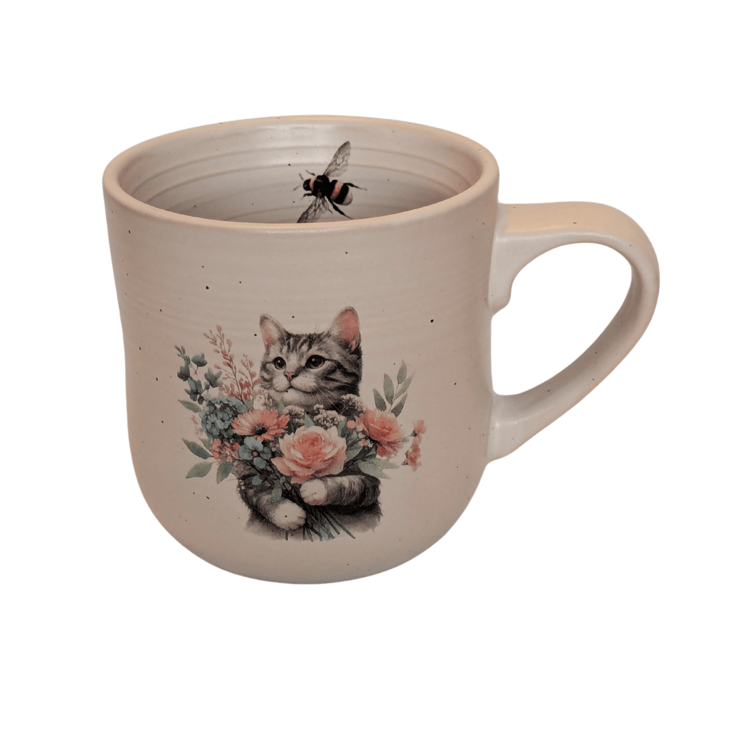 A stoneware mug with an image of a grey cat holding a bunch of flowers and a small bee motif on the inner mug.